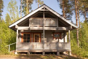 Фото номера Коттедж с видом на озеро Курортные отели Holiday Village Kukkapää г. Сулкава 11