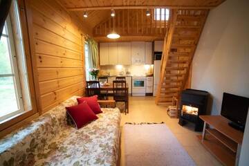Фото номера Коттедж с видом на озеро Курортные отели Holiday Village Kukkapää г. Сулкава 12