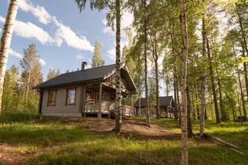 Фото номера Коттедж с видом на озеро Курортные отели Holiday Village Kukkapää г. Сулкава 21