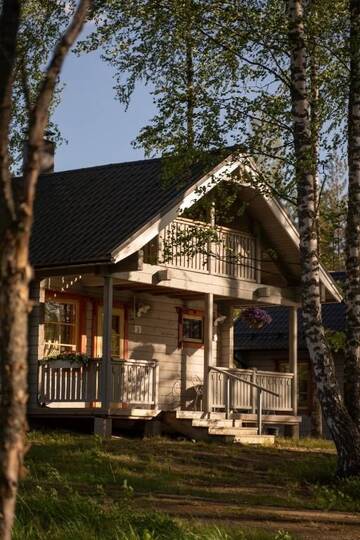 Фото номера Коттедж с видом на озеро Курортные отели Holiday Village Kukkapää г. Сулкава 20